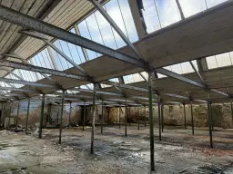 Voormalige textielfabriek op perceel van 5.493 m² in Walddorf - Duitsland